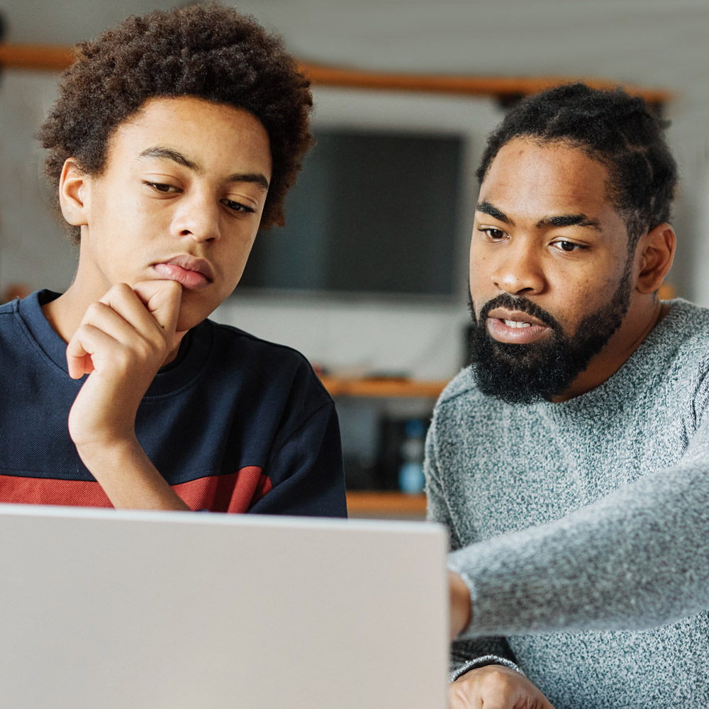 Male-Tutor-teaches-Teen Male Tutor teaches teen boy on computer